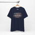 Built to Endure T-Shirt - Patriotic Est. 1776 Tee displayed on a hanger with minimalist design.