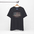 Built to Endure T-Shirt - Patriotic Est. 1776 Tee displayed on a hanger with minimalist design.